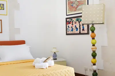 Letto o letti in una camera di Camera con bagno privato vista mare Ortigia