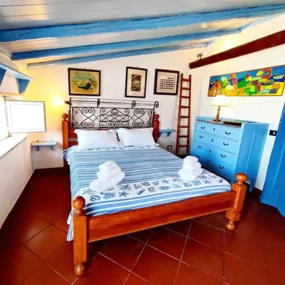 Letto o letti in una camera di Terrazza sul mare attico 