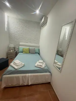 Letto o letti in una camera di L’Arco di Athena