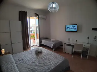 Letto o letti in una camera di B&B Costa Sicula