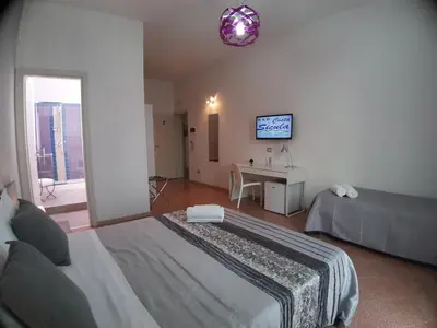 Letto o letti in una camera di B&B Costa Sicula