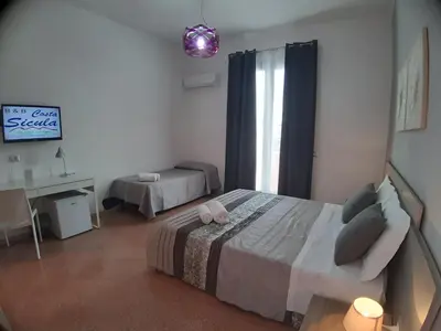 Letto o letti in una camera di B&B Costa Sicula