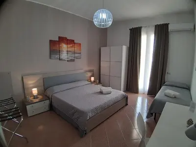 Letto o letti in una camera di B&B Costa Sicula