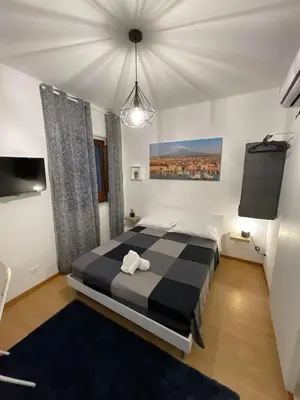 Letto o letti in una camera di Sottinsù Appartamenti