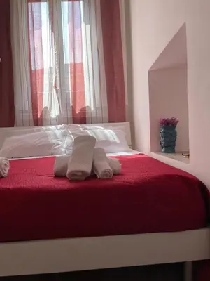 Letto o letti in una camera di Sottinsù Appartamenti