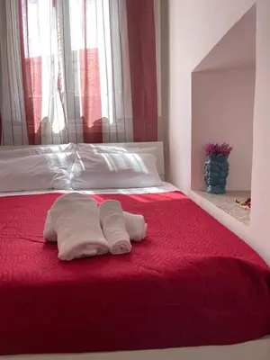 Letto o letti in una camera di Sottinsù Appartamenti