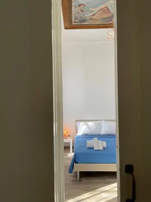 Letto o letti in una camera di Sottinsù Appartamenti