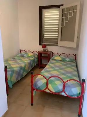 Letto o letti in una camera di Casa vacanze “Ficupala”
