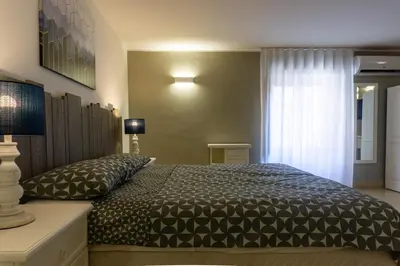 Letto o letti in una camera di Mi Tú Apartments