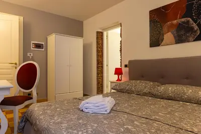 Letto o letti in una camera di Mi Tú Apartments