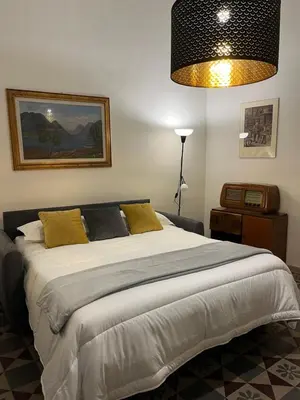 Letto o letti in una camera di Casa Caruso