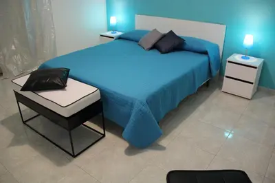 Letto o letti in una camera di Camere Amarzè Plus