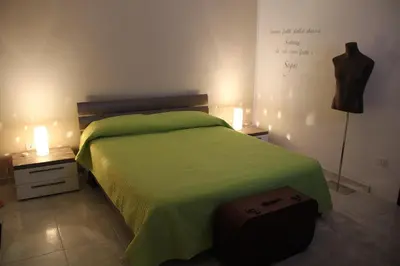 Letto o letti in una camera di Camere Amarzè Plus