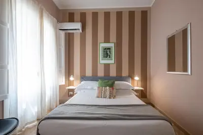 Letto o letti in una camera di Palazzo Gilistro
