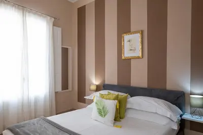 Letto o letti in una camera di Palazzo Gilistro