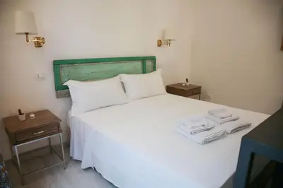 Letto o letti in una camera di Lanterne Magiche Ortigia - Dependances