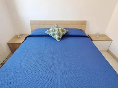 Letto o letti in una camera di Villa Syraka