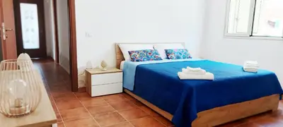 Letto o letti in una camera di Villa Syraka