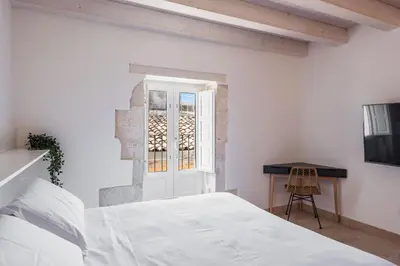 Letto o letti in una camera di Giudecca Apartments by Wonderful Italy