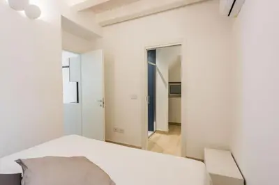 Letto o letti in una camera di Giudecca Apartments by Wonderful Italy