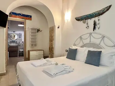 Letto o letti in una camera di La Dimora delle Ninfe