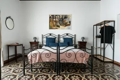 Letto o letti in una camera di Ciuriddia Home by Homes4Holidays
