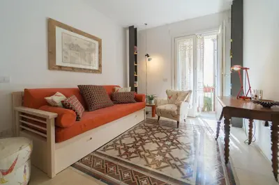 Area soggiorno di GuestHost - Ortigia Studios - Charming Apartments