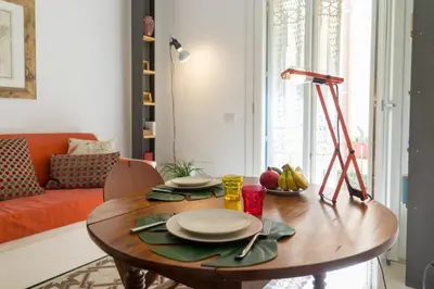 Area soggiorno di GuestHost - Ortigia Studios - Charming Apartments