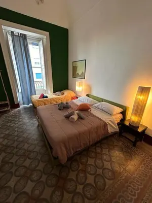 Letto o letti in una camera di Casa Kalù