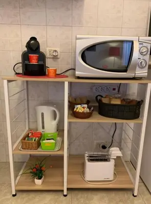 Cucina o angolo cottura di THE AIRPORT HOUSE
