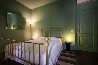 Letto o letti in una camera di Le Stanze del Cioccolato