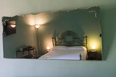 Letto o letti in una camera di Le Stanze del Cioccolato