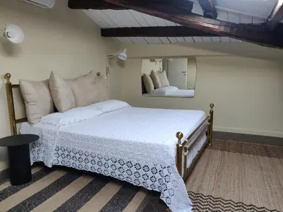 Letto o letti in una camera di Le Stanze del Cioccolato
