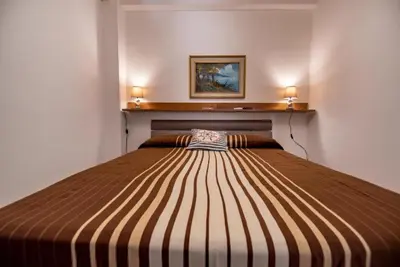 Letto o letti in una camera di Villa Donata Fontane Bianche