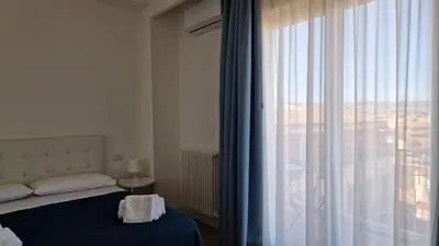 Letto o letti in una camera di Orlando Rooms