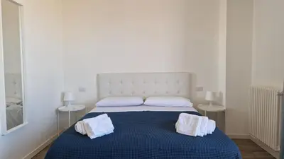 Letto o letti in una camera di Orlando Rooms