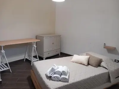 Letto o letti in una camera di Casa Antica Grecia