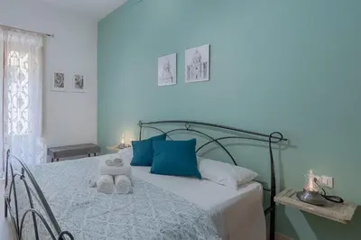 Letto o letti in una camera di Noto Barocca - HolidayHome