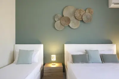 Letto o letti in una camera di Villa Merilusi Apartments