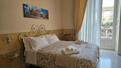 Letto o letti in una camera di Bellini Inn Deluxe