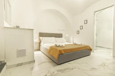 Letto o letti in una camera di Dimora Bianca