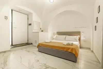 Letto o letti in una camera di Dimora Bianca