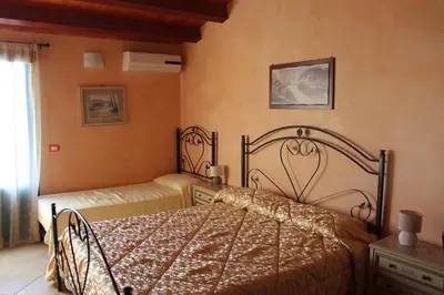 Letto o letti in una camera di Agorà-Akrai B&B