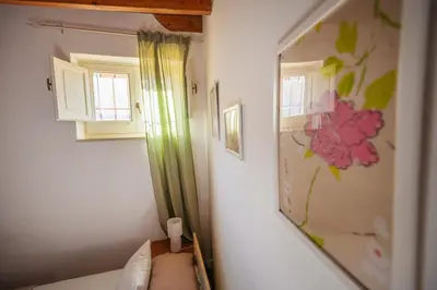 Letto o letti in una camera di Anacreonte Ortigia Apartment