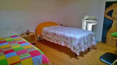 Letto o letti in una camera di Casa vacanze Fuori Tema