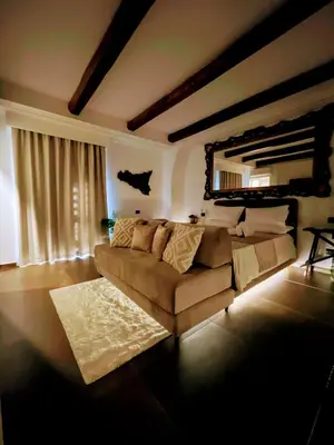Area soggiorno di Liborio Homes