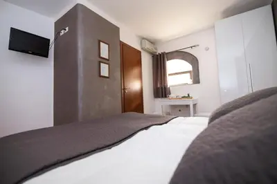 Letto o letti in una camera di Bed and Breakfast Alberini