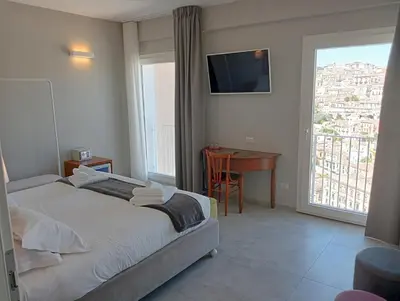 Letto o letti in una camera di Itria Modica