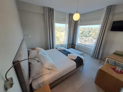Letto o letti in una camera di Itria Modica