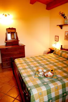 Letto o letti in una camera di Fattoria Terra e Libertà